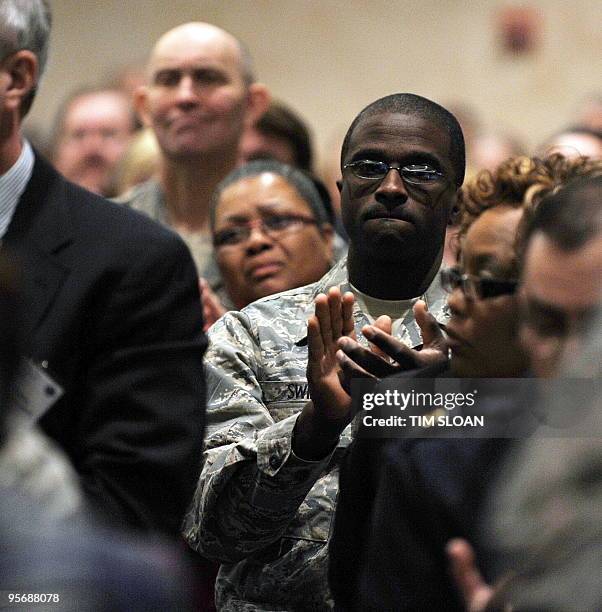 People listen to speakers during a DOD/VA sponsored conference on suicide prevention on January 11, 2010 at the Capitol Hilton in Washington, DC. AFP...