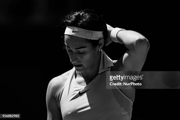 The image has been converted to black and white) Caroline Garcia of France looks down in her match against Carla Suarez Navarro of Spain during day...