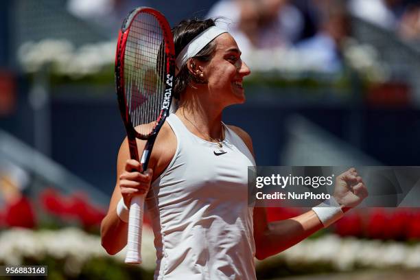 Caroline Garcia of France celebrates the victory in her match against Carla Suarez Navarro of Spain during day six of the Mutua Madrid Open tennis...