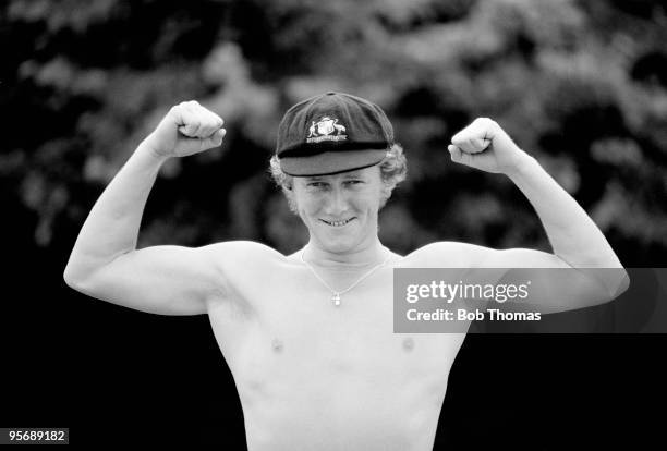 Young Australian batsman Kim Hughes flexes his muscles on the last day of the touring match between Northamptonshire and Australia, 19th July 1977....