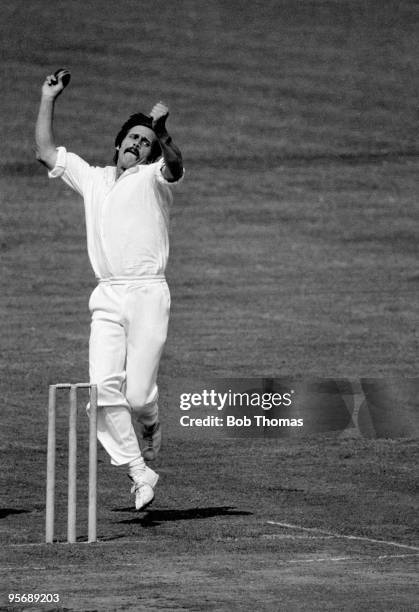 Peter Lee bowling for Lancashire against Northamptonshire in the County Championship match at the County Ground in Northampton, 10th August 1977. The...