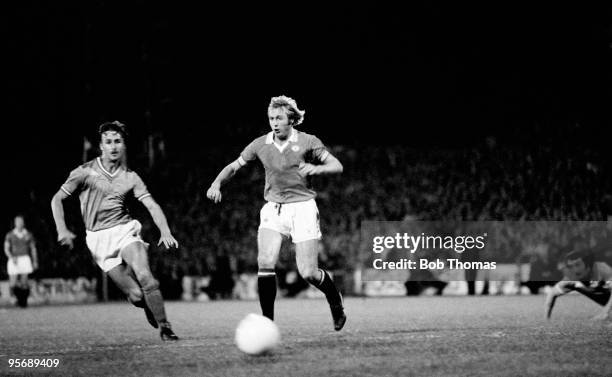 Manchester United striker Jimmy Greenhoff evades a St Etienne defender during the European Cup Winners Cup 1st round 2nd leg match played at Home...