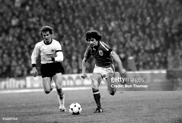 England striker Kevin Keegan is chased by West Germany's Rainer Bonhof during the friendly International match at the Olympic Stadium in Munich, 22nd...