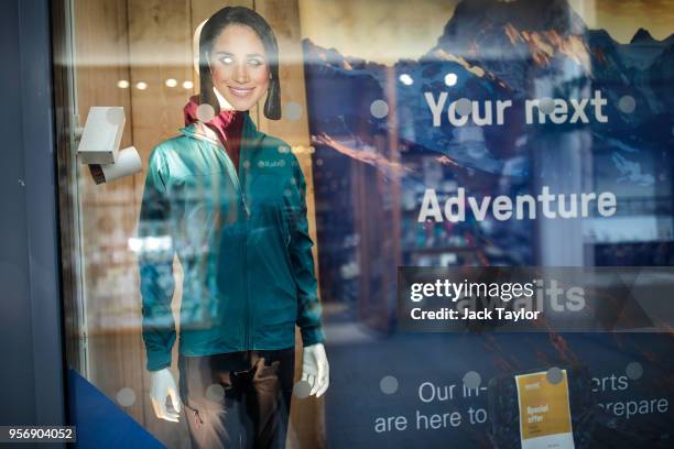Cardboard mask of US actress Meghan Markle sits on a mannequin in the window of a camping shop ahead of the wedding of Prince Harry and his fiance...
