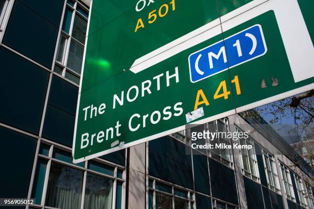 Road sign for the M1 and The North in London, England, United Kingdom.