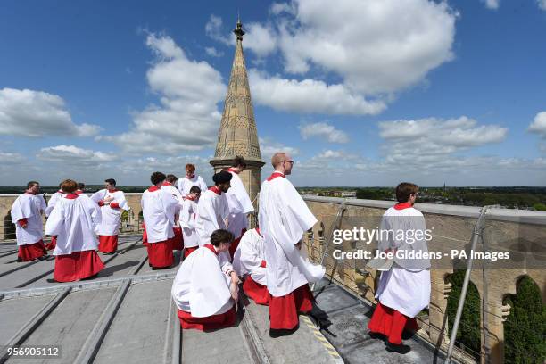 Choristers from St John's College, Cambridge, take in the view before performing the Ascension Day carol from the top of the Chapel Tower at St...