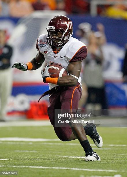 Tailback David Wilson of the Virginia Tech Hokies runs with the ball during the Chick-fil-A Bowl against the Tennessee Volunteers at the Georgia Dome...