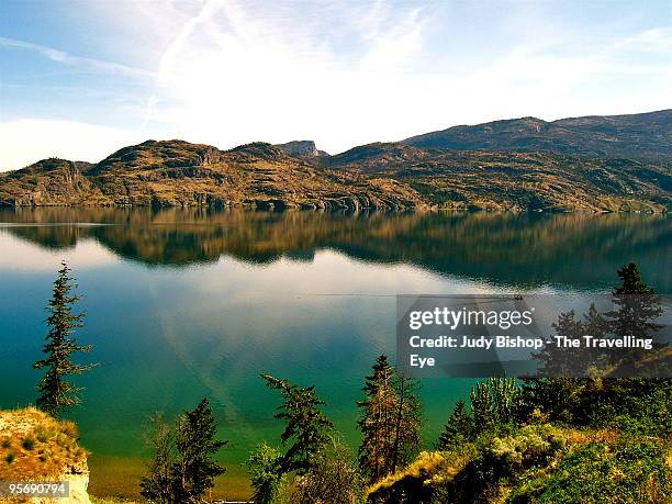 boating the calm waters of okanagan lake - kelowna stock pictures, royalty-free photos & images