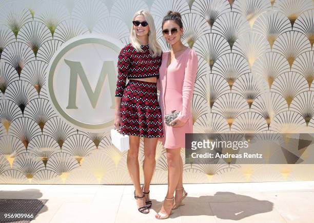 Lena Gercke and attend the Magnum photocall during the 71st annual Cannes Film Festival at Magnum Beach on May 10, 2018 in Cannes, France.