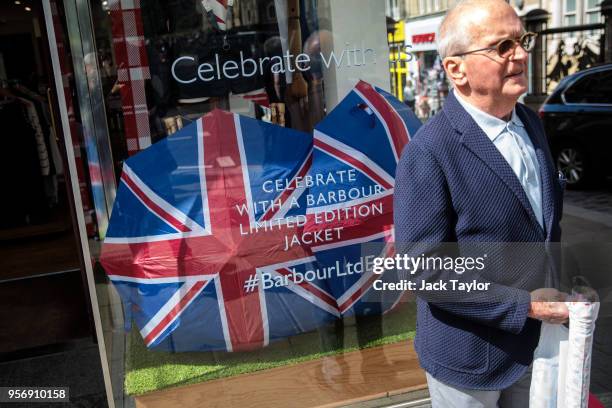 Union Jack umbrellas sits in a clothes shop window ahead of the wedding of Prince Harry and his fiance US actress Meghan Markle on May 10, 2018 in...