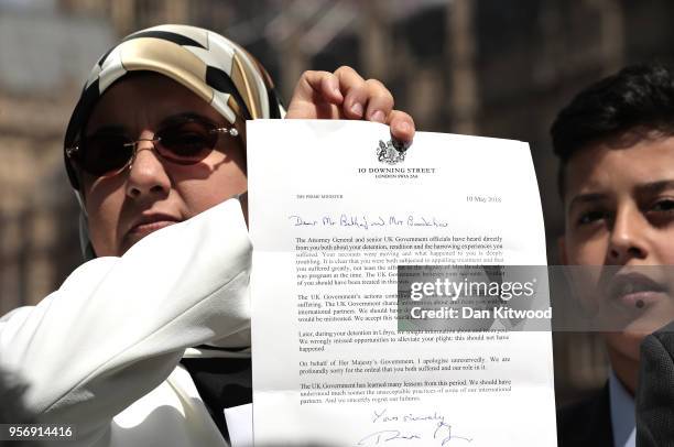 The wife of former Islamist fighter turned politician Abdel Hakim Belhaj, Fatima Boudchar, holds a letter of apology from British Prime Minister...