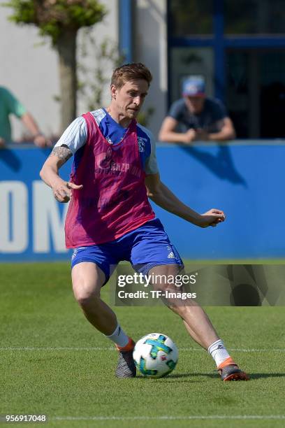 Bastian Oczipka of Schalke controls the ball during a training session at the FC Schalke 04 Training center on May 9, 2018 in Gelsenkirchen, Germany.