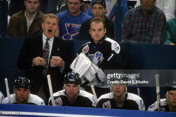 Tampa Bay Lightning coach Terry Crisp with goalie Wendell Young behind bench with teammates during game vs St. Louis Blues at St. Louis Arena. St....