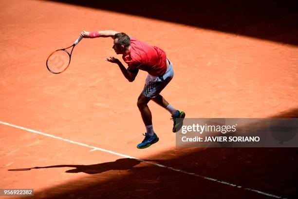 Germany's Philipp Kohlschreiber serves to South Africa's Kevin Anderson during their ATP Madrid Open round of 16 tennis match at the Caja Magica in...