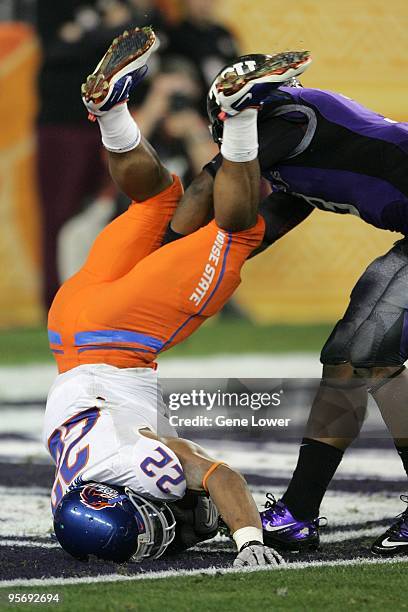 Boise State running back Doug Martin flips upside down and scores the eventual game winning touchdown during the Fiesta Bowl against the TCU Horned...