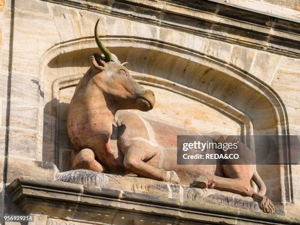 Sculpture of a cow in the medieval Old Town at the Alte Fleischhalle in Klein Venedig Bamberg in Franconia. A part of Bavaria. The Old Town is listed...