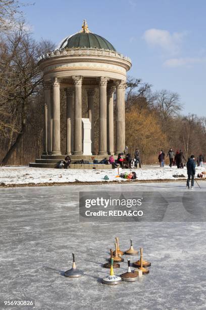 Nymphenburg Palace canals and park during winter. Badenberger See and Monopterus. Munich. Germany. It is an old tradition in Munich. That. As soon as...