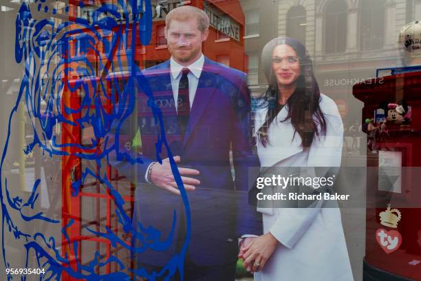 Week before the royal wedding between Prince Harry and Meghan Markle, their life-size cut-outs have been positioned behind the outline of a British...