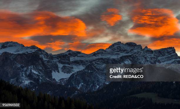 Dawn over the mountain range of the nature park Puez - Geisler - Odle in the Dolomites of South Tyrol - Alto Adige. The Dolomites are listed as...