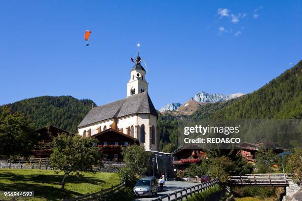 Pilgrimage church Maria Schnee in Obermauern. Eastern Tyrol. With paraglider. Europe. Central Europe. Austria. East Tyrol.