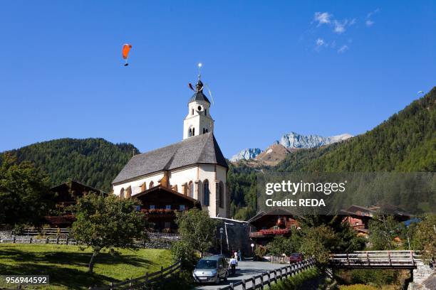 Pilgrimage church Maria Schnee in Obermauern. Eastern Tyrol. With paraglider. Europe. Central Europe. Austria. East Tyrol.