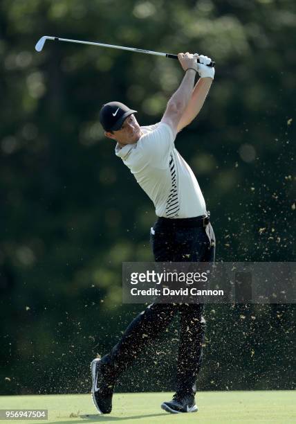 Rory McIlroy of Northern Ireland plays his second shot on the par 4, 14th hole during the first round of the THE PLAYERS Championship on the Stadium...