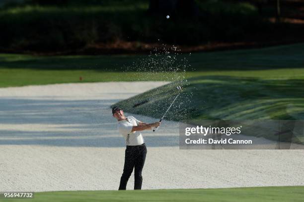 Rory McIlroy of Northern Ireland plays his third shot on the par 5, 11th hole during the first round of the THE PLAYERS Championship on the Stadium...