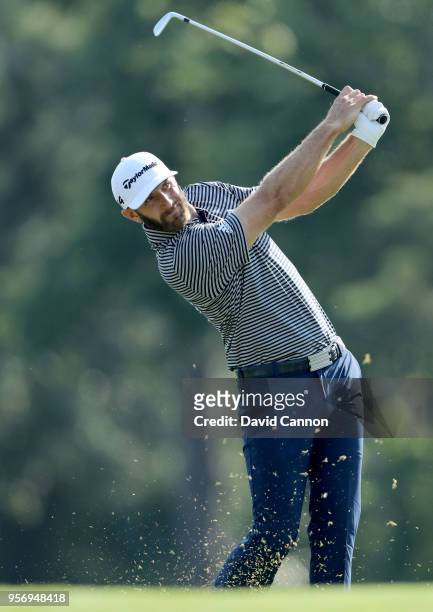 Dustin Johnson of the United States plays his second shot on the par 4, 14th hole during the first round of the THE PLAYERS Championship on the...