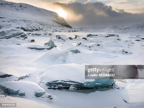 Glacier Svinafellsjoekul in the Vatnajoekull NP during winter. The glacier front and the frozen glacial lake. Europe. Northern Europe. Iceland....