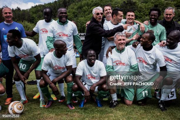 Aime Jacquet , former coach of French national football team poses with formers Saint-Etienne players before a football match between former French...