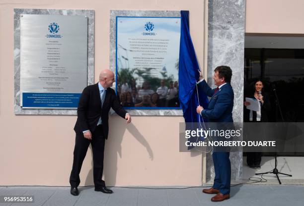 The president of the South American Football Confederation Alejandro Dominguez and FIFA's President Gianni Infantino unveil a plaque at the...