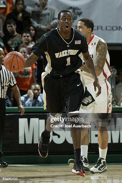 Al-Farouq Aminu of the Wake Forest Demon Deacons brings the ball up court against the Miami Hurricanes on January 9, 2010 at the BankUnited Center in...