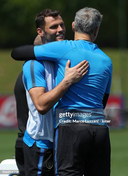 Francesco Toldo of Inter Forever embraces Daniele Padelli of FC Internazionale during the FC Internazionale training session at the club's training...