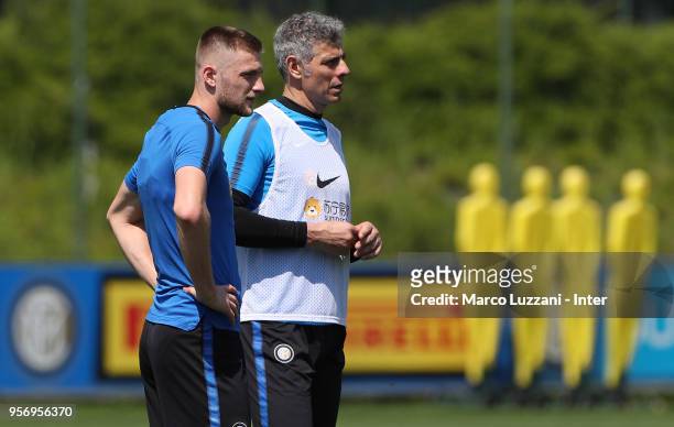 Milan Skriniar of FC Internazionale and Francesco Toldo of Inter Forever look on during the FC Internazionale training session at the club's training...