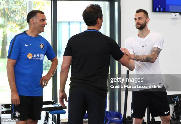 Marcelo Brozovic of FC Internazionale shakes hands with Riccardo Ferri and Giuseppe Bergomi of Inter Forever during the FC Internazionale training...