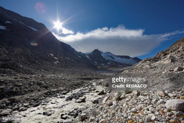 The glacier Viltragenkees in the National Park Hohen Tauern is showing signs of rapid retreat. Its snout is flat and covered with moraine. The...