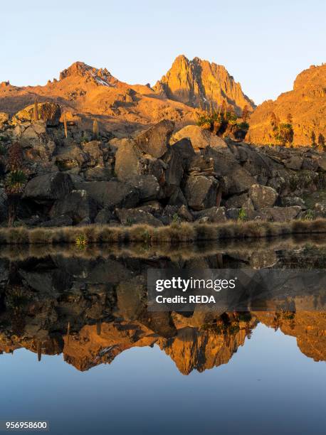 Mount Kenya national park in the highlands of central Kenya. A UNESCO world heritage site. Sunrise over the central part of Mount Kenya with the...