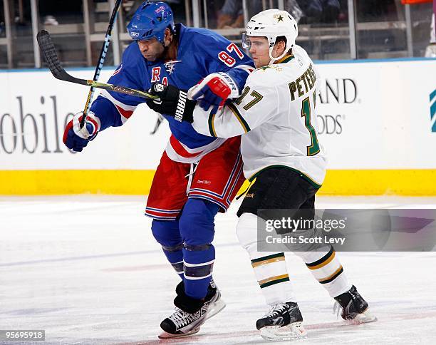 Donald Brashear of the New York Rangers attempts to block his opponent Toby Petersen of the Dallas Stars on January 6, 2010 at Madison Square Garden...