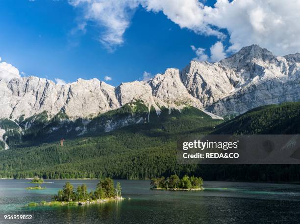 Lake Eibsee with Mt. Zugspitze on the right during evening with the Wetterstein Mountain Range close to Garmisch-Partenkirchen in county Werdenfelser...