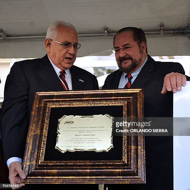 Defacto Honduran President, Roberto Micheletti , is awarded a plaque honouring him as "the first national hero of the XXI century in defense of...