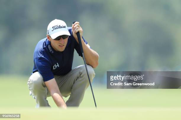 Richy Werenski of the United States lines up a putt on the ninth green during the first round of THE PLAYERS Championship on the Stadium Course at...
