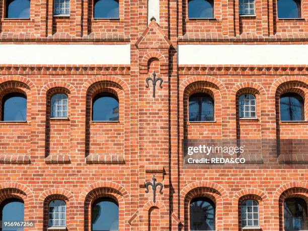 Old warehouses in traditional brick stone architecture in the harbour. Buildt in the beginning of the 20th century. The Hanseatic City Stralsund. The...