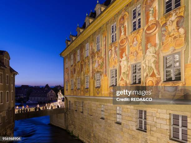 The Alte Rathaus . The landmark of Bamberg. A crowd having a party on the Untere Bruecke. Bamberg in Franconia. A part of Bavaria. The Old Town is...