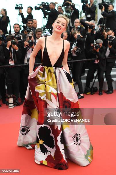 Actress Amber Heard poses as she arrives on May 10, 2018 for the screening of the film "Sorry Angel " at the 71st edition of the Cannes Film Festival...