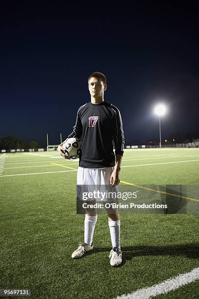 soccer player on soccer field - football player standing stock pictures, royalty-free photos & images