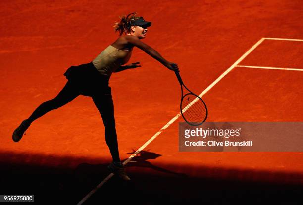 Maria Sharapova of Russia serves against Kiki Bertens of the Netherlands in their quarter final match during day six of the Mutua Madrid Open tennis...