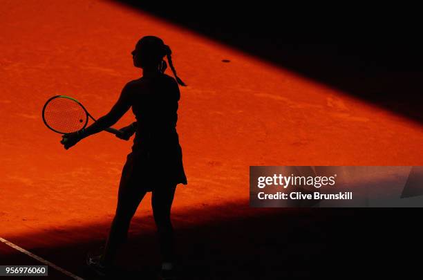 Kiki Bertens of the Netherlands serves against Maria Sharapova of Russia in their quarter final match during day six of the Mutua Madrid Open tennis...