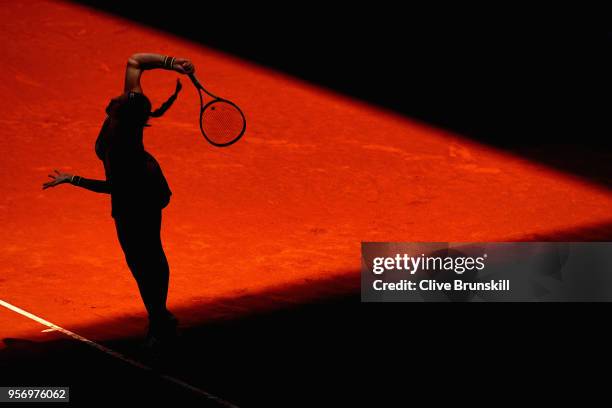 Kiki Bertens of the Netherlands serves against Maria Sharapova of Russia in their quarter final match during day six of the Mutua Madrid Open tennis...