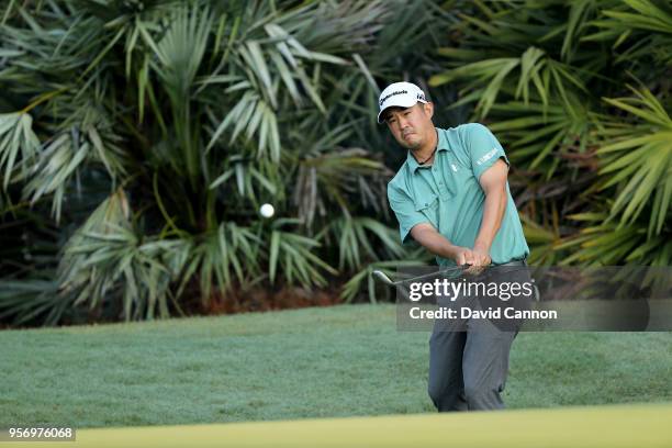 John Huh of the United States plays his third shot on the par 4, 10th hole during the first round of the THE PLAYERS Championship on the Stadium...