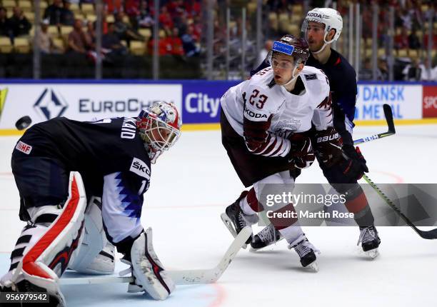 Keith Kinkaid, goaltender of United States makes a save on Teodors Blugers of Latvia during the 2018 IIHF Ice Hockey World Championship Group B game...